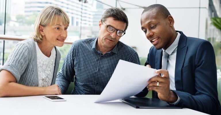 advisor speaking with older couple